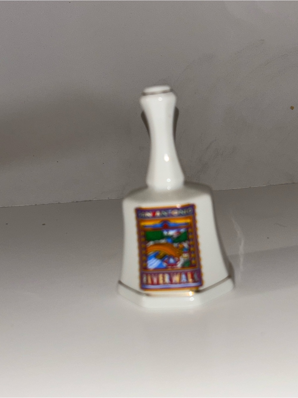 White Ceramic Collectible Bell with Colorful Scenic Emblem